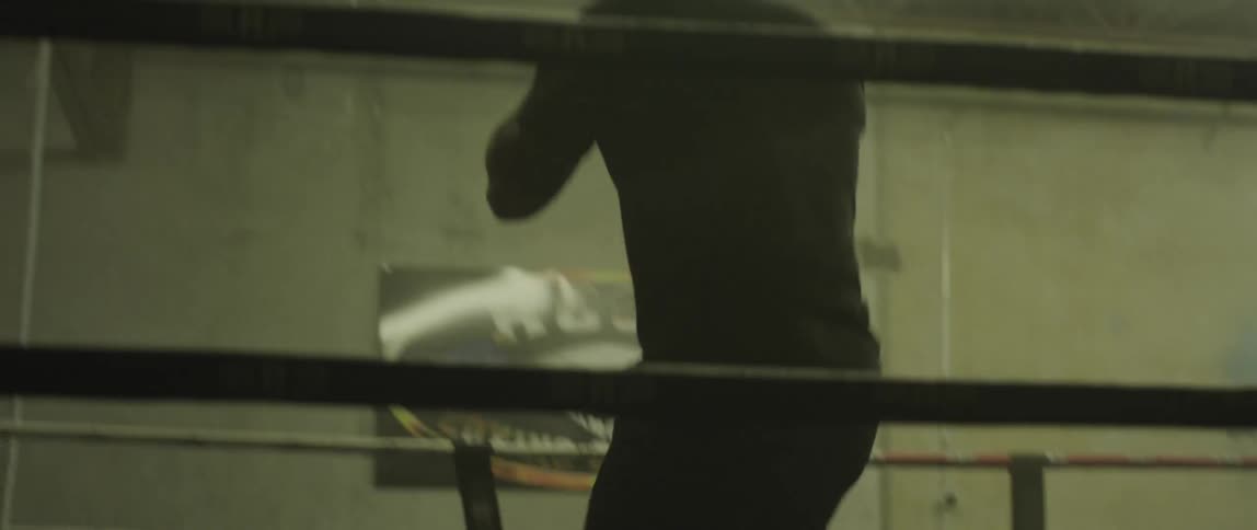 Man shadow boxes in ring
