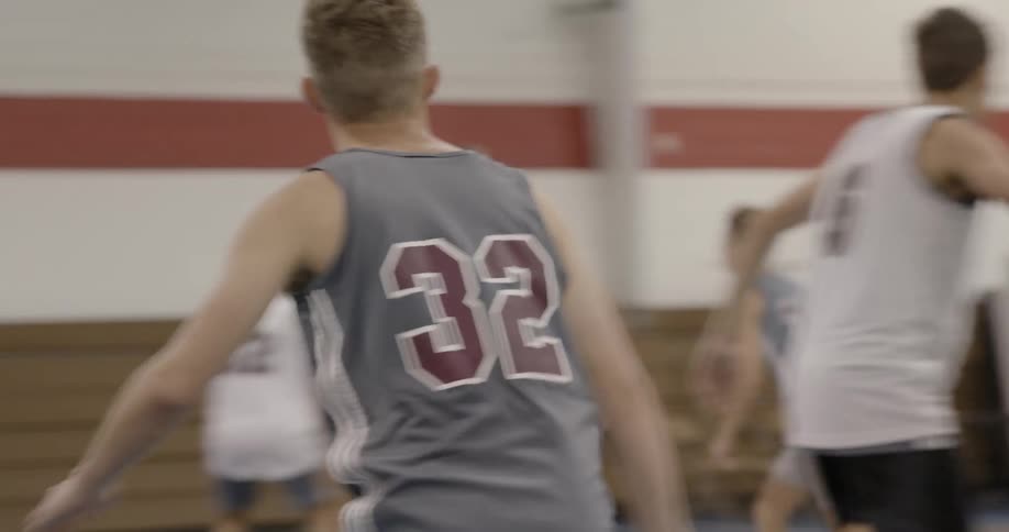 A group of kids playing basketball