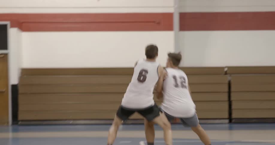 Teenagers playing basketball