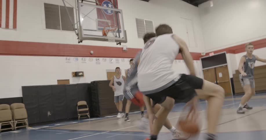 People play basketball at a quick pace