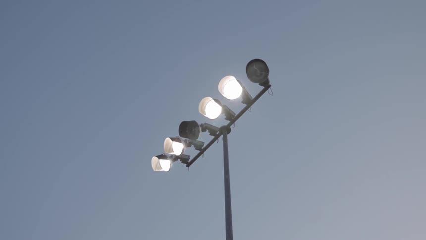 Bright lights that are on the top of a pole