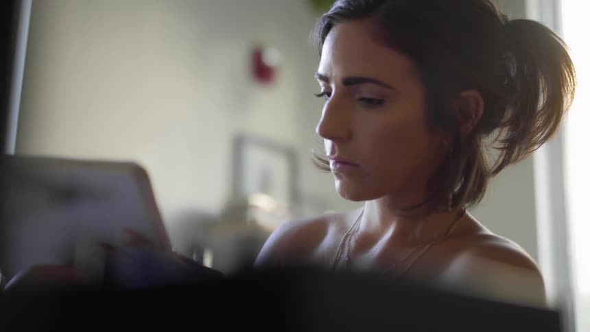 A woman writing in a notebook