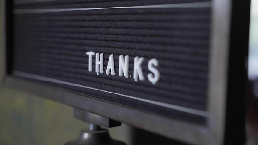 A black message board