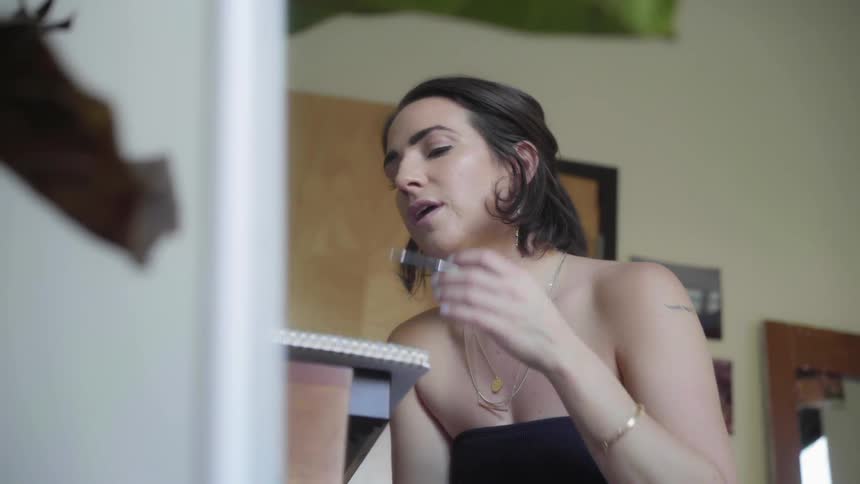 A woman speaks pondering what to write down