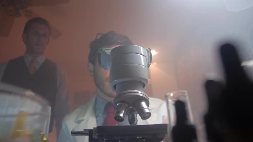 A man using a microscope