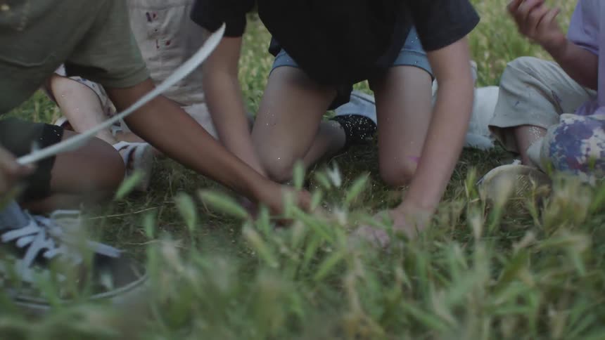 Children play in grass