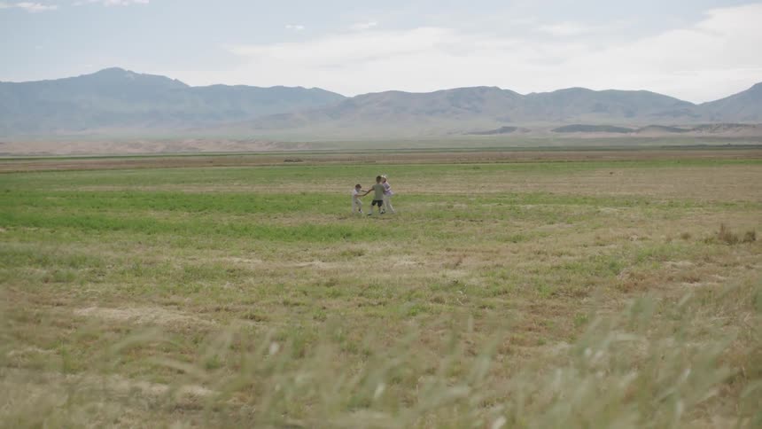 A group of kids playing in a field