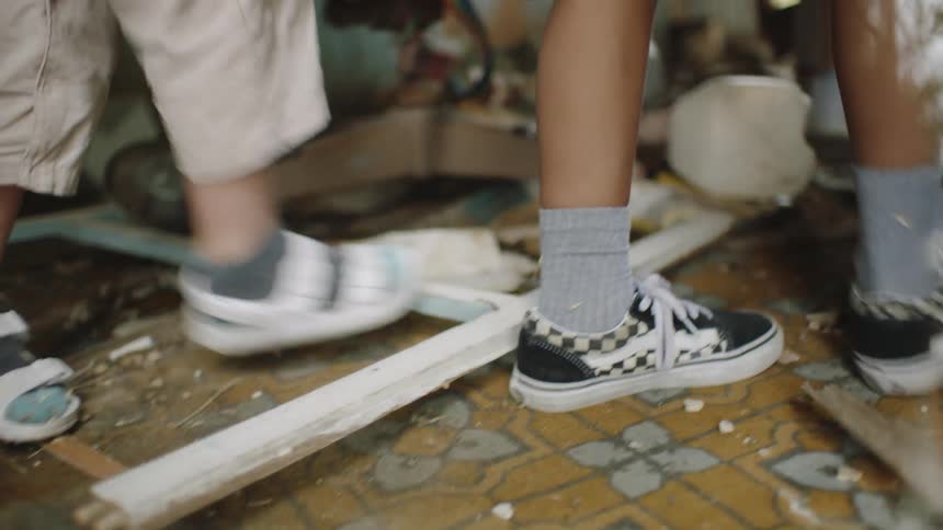 Children walking through a ruined building