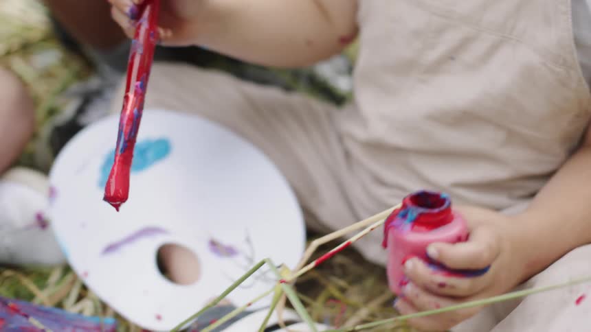 A child playing with paint