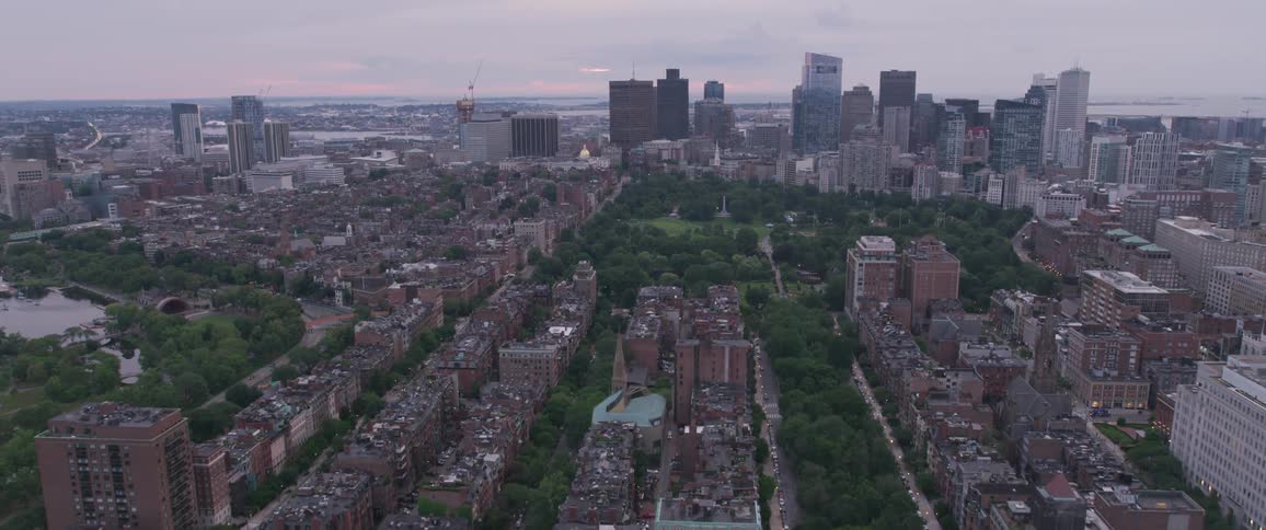 An aerial view of a downtown city is displayed