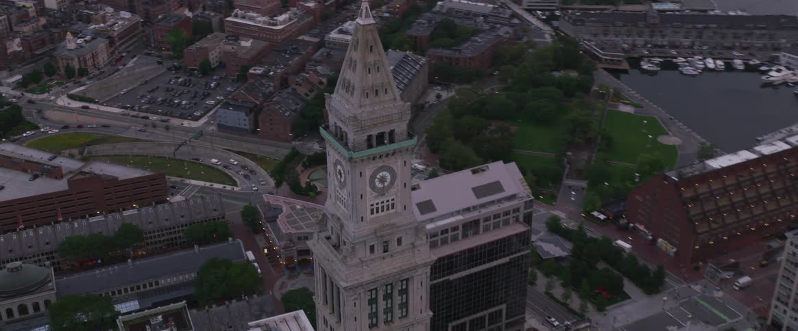 A clock tower looms over a city