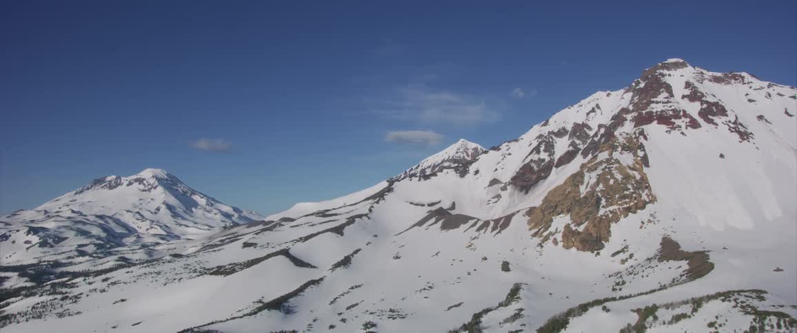 Landscape of the snowy mountains on a sunny day in the daytime