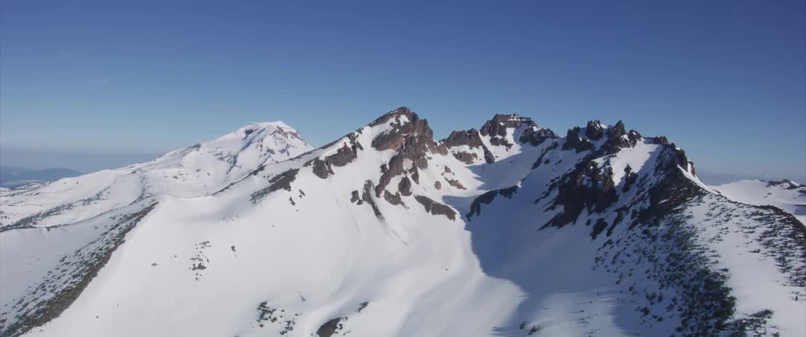 Tall snow capped mountain tops