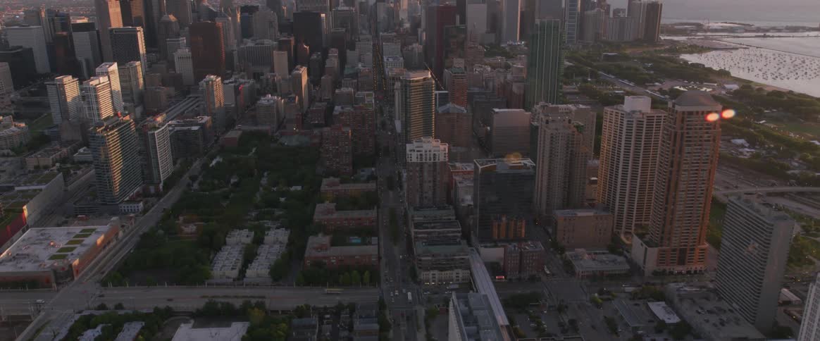 Skyline of the city next to the sea while the sun goes down