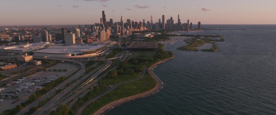 Traffic drives into a large urban area