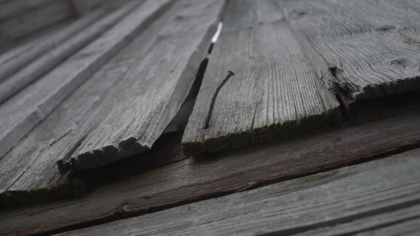 An old structure with loose boards and nails
