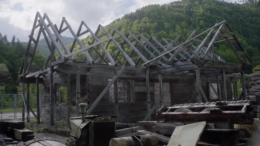 Partly built weathered wooden frame house