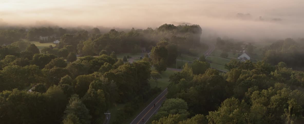An aerial view of a town on foggy day