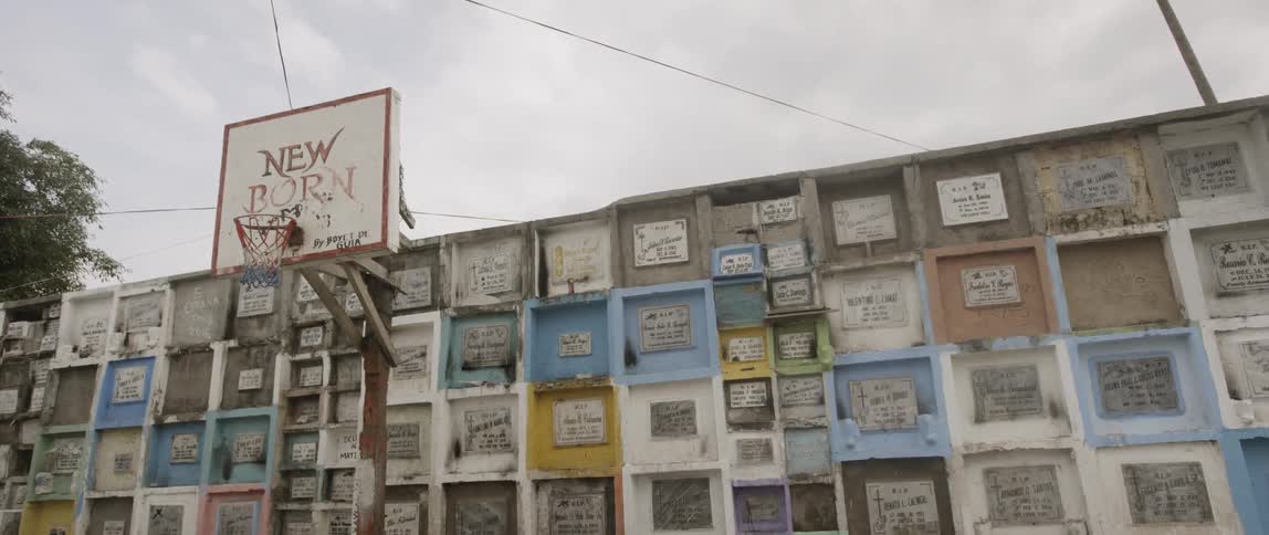 A wall of many frames each with a message posted within behind a basketball goal