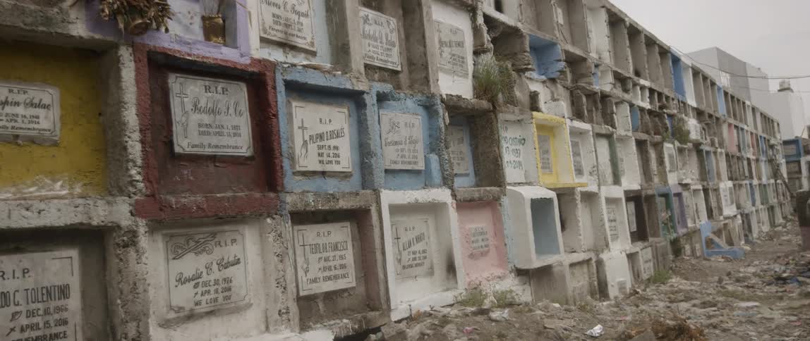A shot of a wall in the middle of a dirt patch