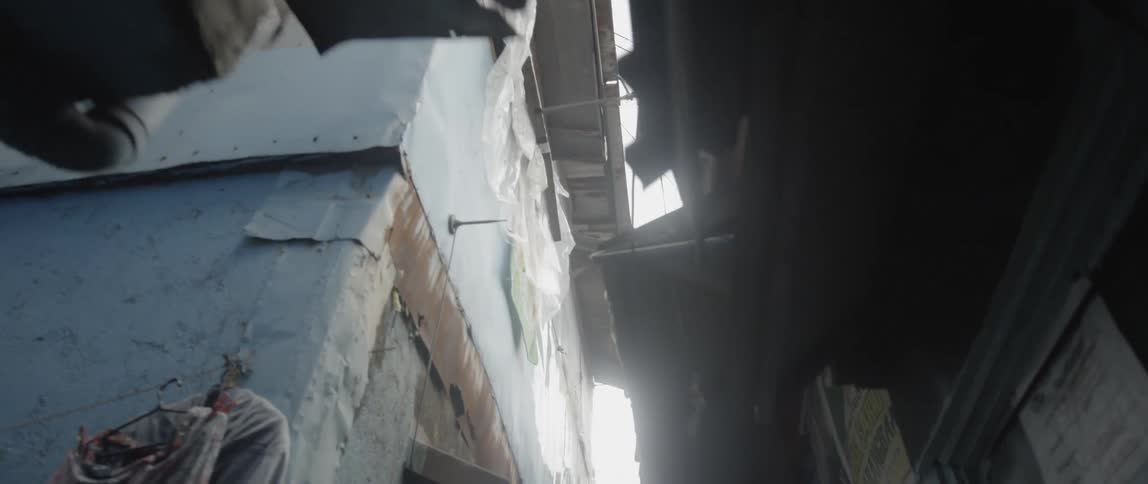 Walking down a decrepit alleyway
