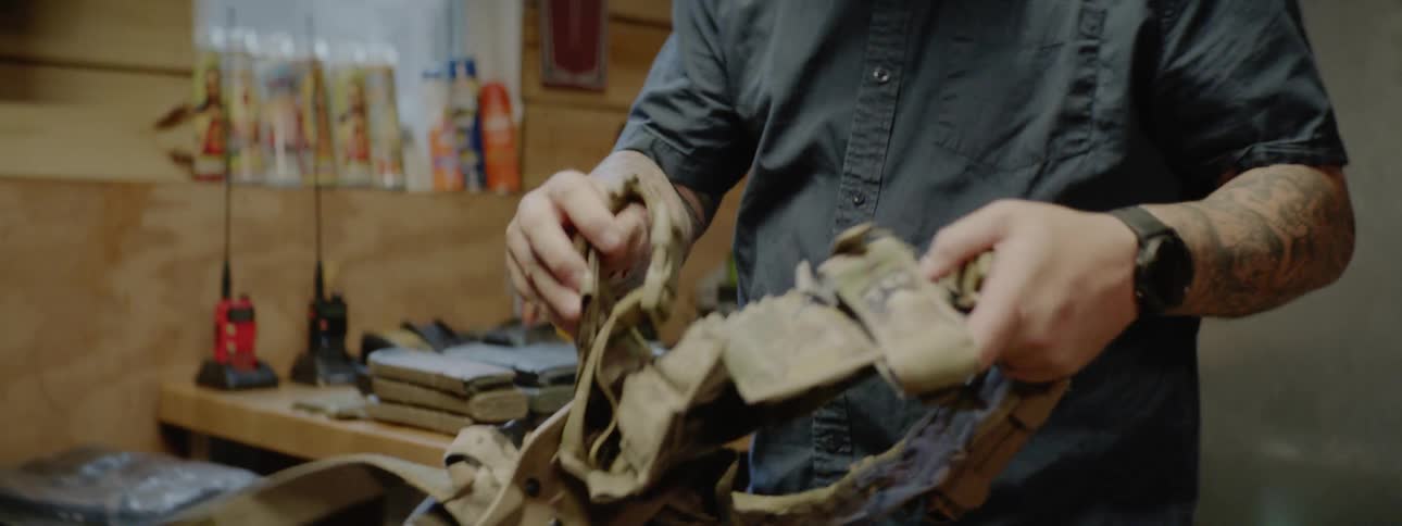 A man picks up a harness