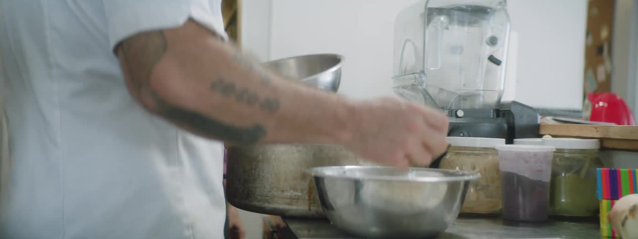 A chef is preparing food in the kitchen