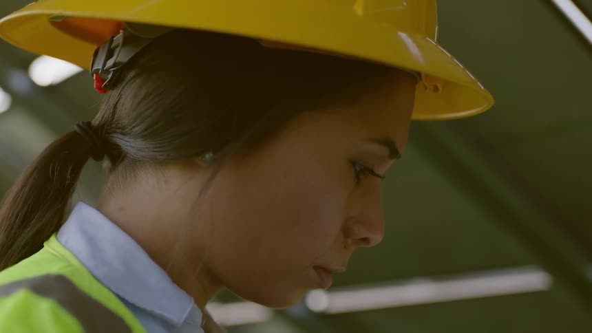 Woman contractor looking at blueprints