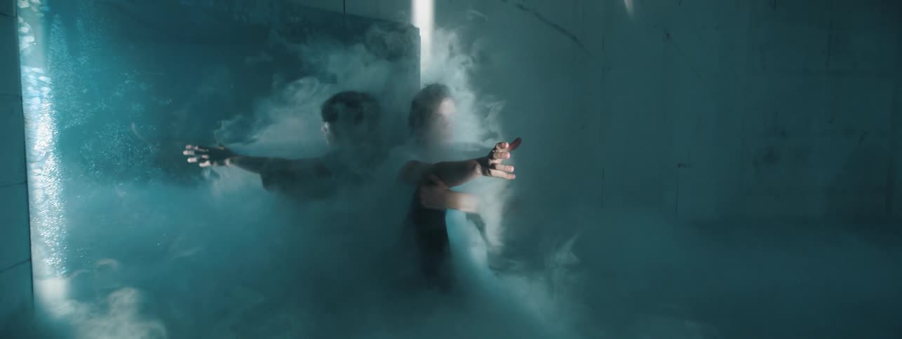 A smoke filled room with a man inside
