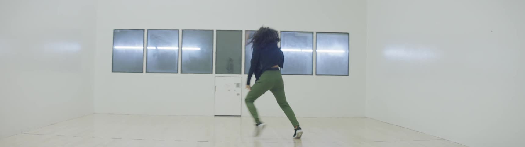 A woman is dancing indoors