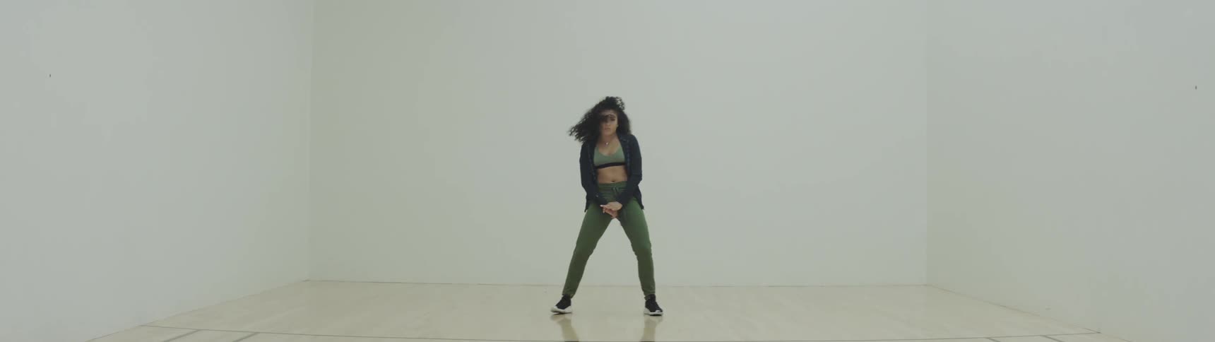 Woman dances in studio