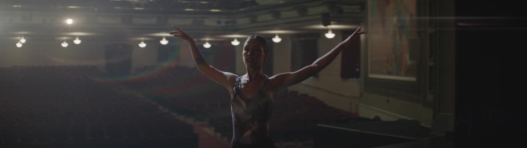 A ballerina dances on a stage