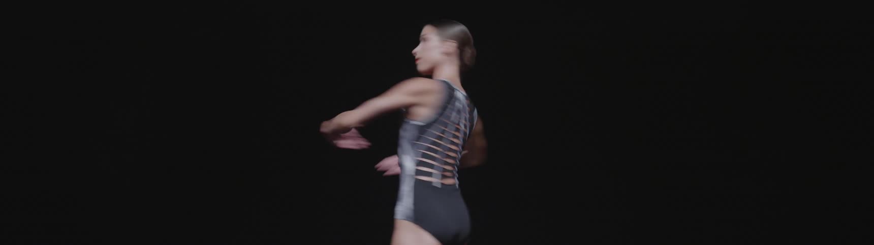 A ballet dancer pirouettes many times