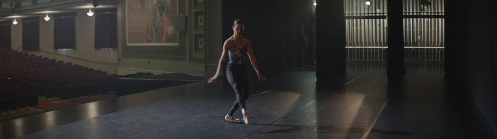 A woman is dancing indoors