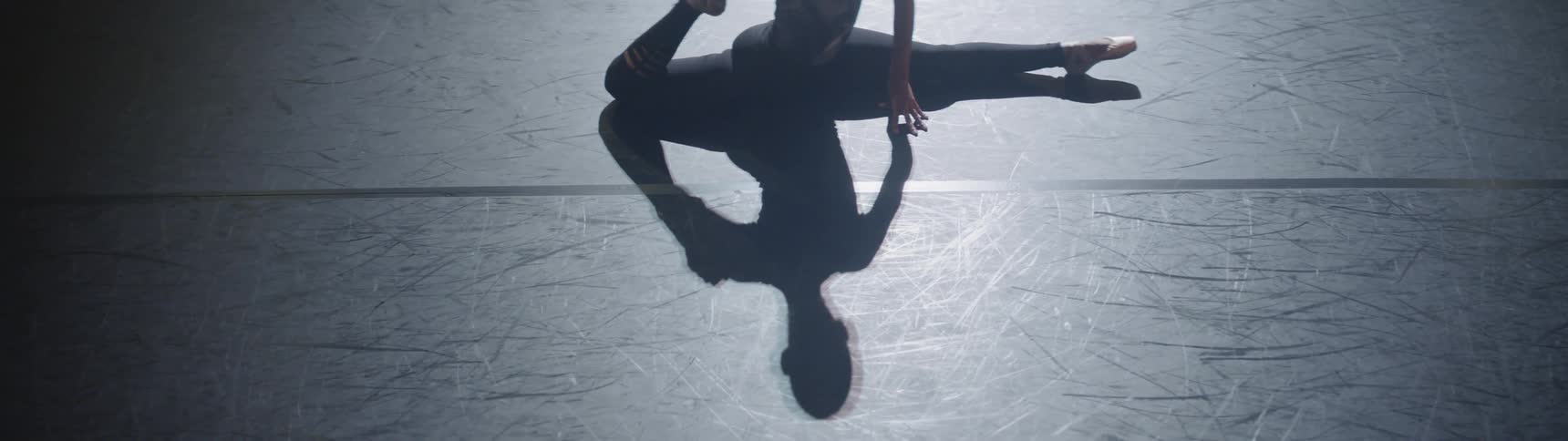 A woman is doing a split on stage