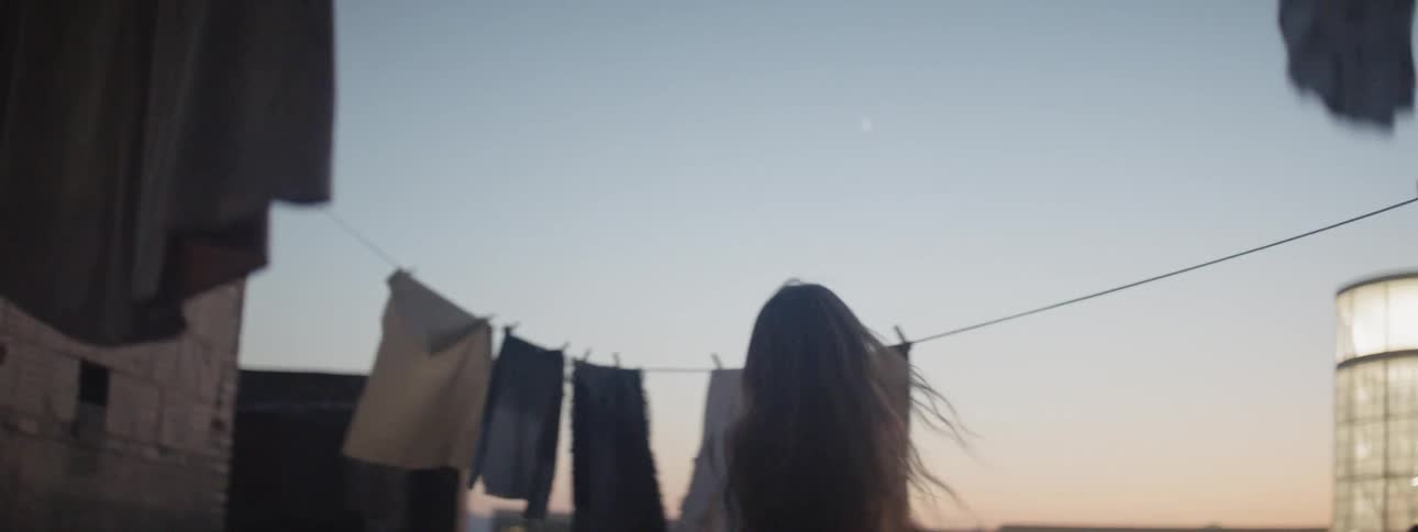 A woman is dancing outdoors