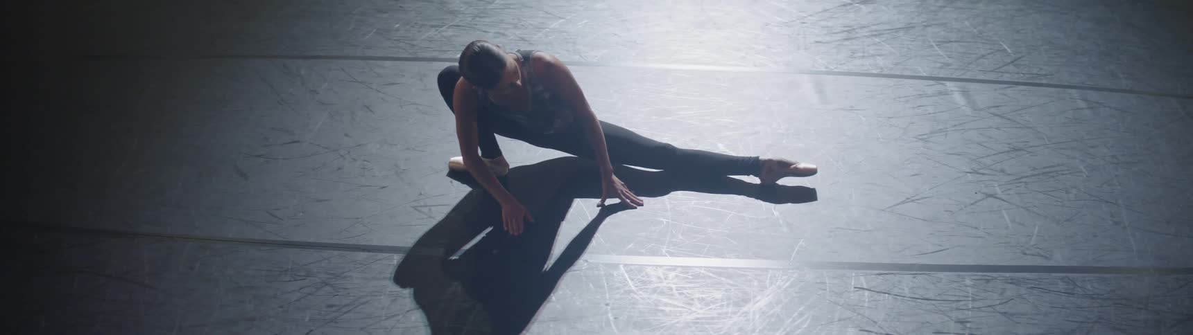 Ballerina does floor stretches