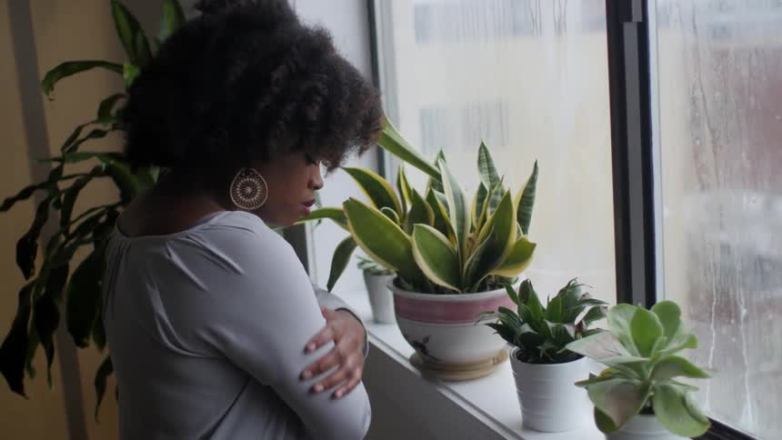 A woman looking at her plants