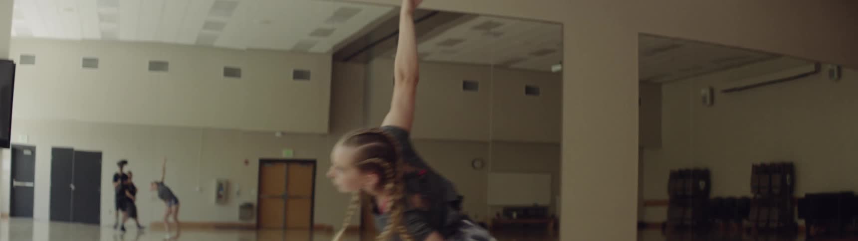 A woman is dancing indoors