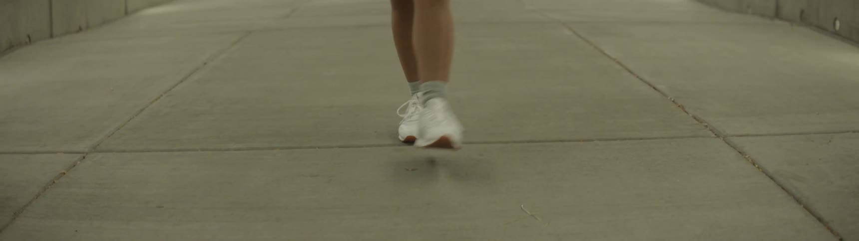 A woman is walking in the tunnel