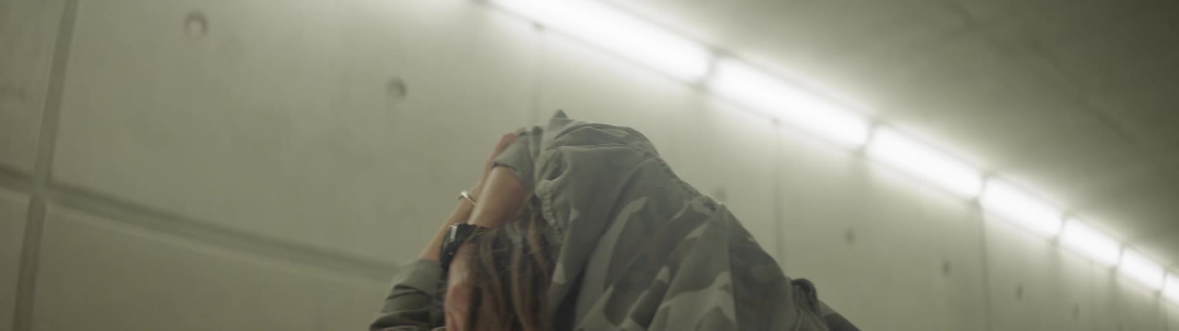 Woman stretching on a hallway