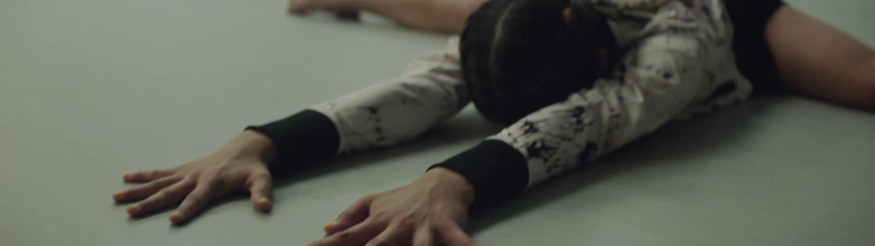 Dancer does floor stretches