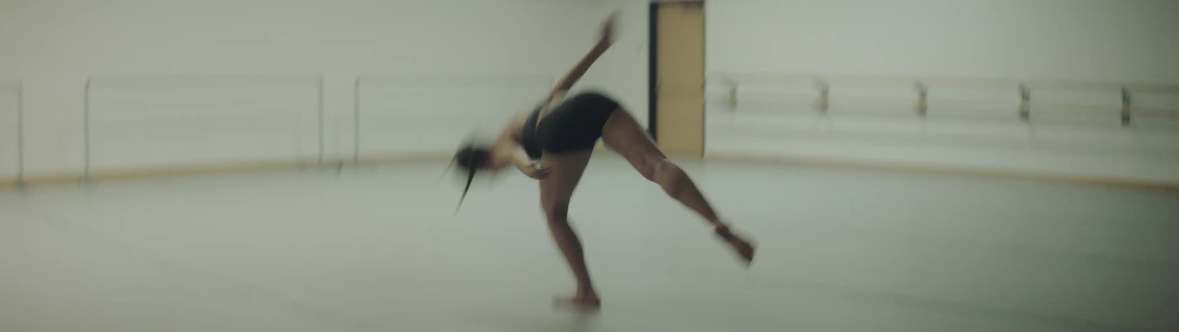 A woman dances in a studio