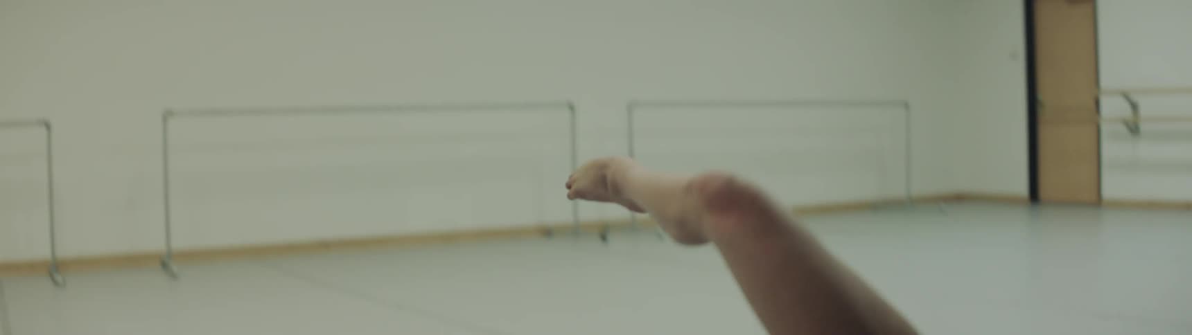 A woman dances in a studio