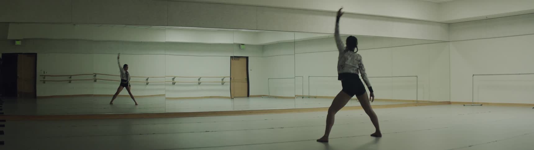 Dancer stretches in dance studio