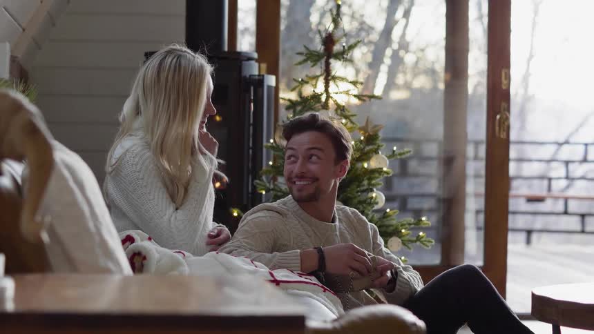 A man opens a gift on christmas
