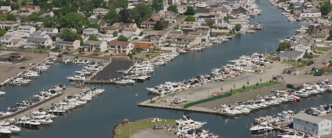 A shoreline with houses and boats