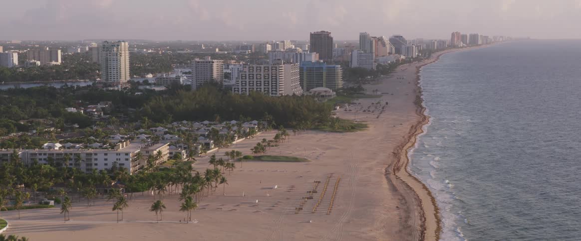 Buildings border beach and ocean