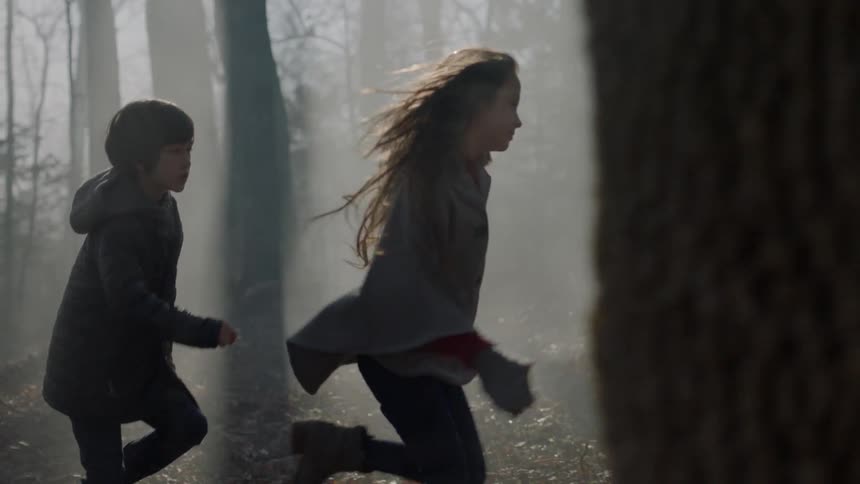 Kids running thru the woods