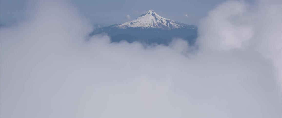 Clouds hide mountain peak